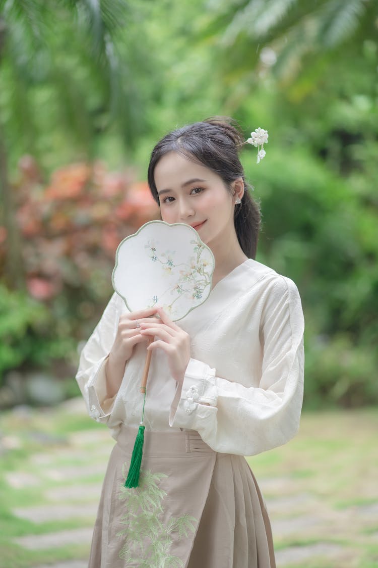 Young Asian Woman Posing In Summer Park