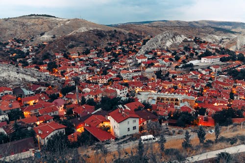 A red town in the mountains with a red roof