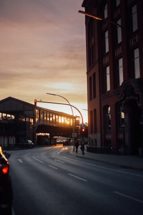 Sun Reflection in Buildings on City Street on Sunset