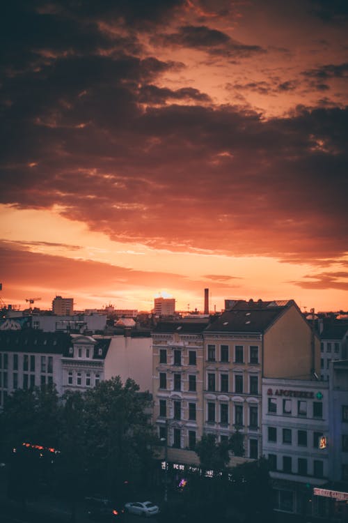 Scenic Clouds above City Buildings on Sunset