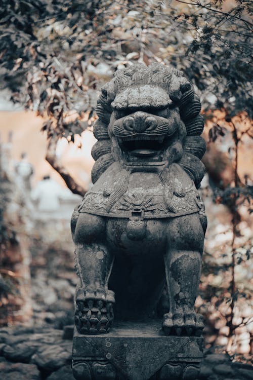 A Concrete Statue of a Chinese Lion