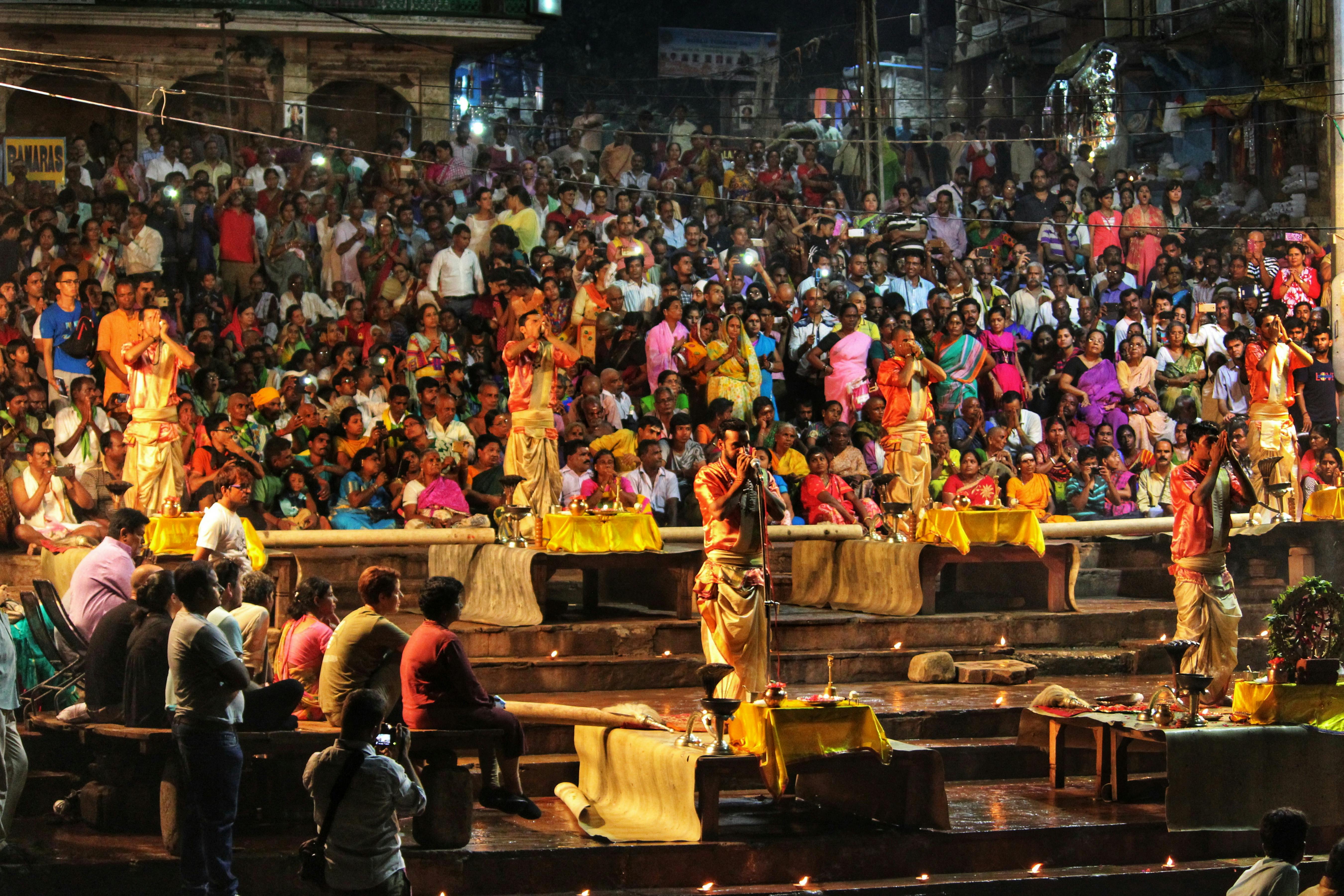 Traditional Hindu ceremony by the Ganges River at night — fire and devotion