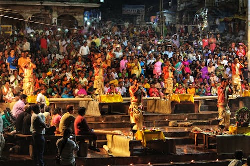 A Crowd Watching Men Perform during a Traditional Celebration 