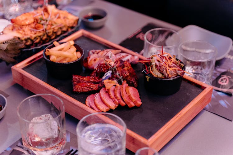 Board With Meat Snacks On Restaurant Table