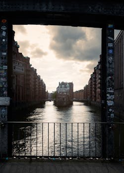 A stunning view of Hamburg's Speicherstadt district with river reflections at dusk.