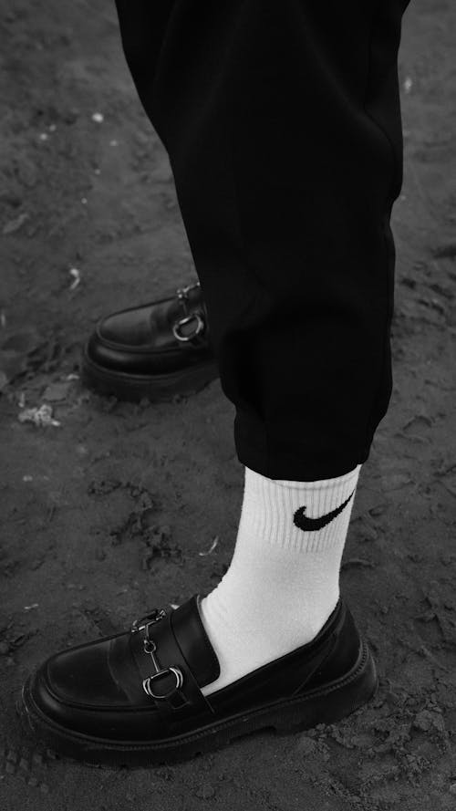 Close-up of a Person Wearing White Socks and Moccasins 