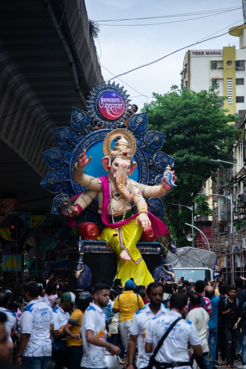 Free Colorful Ganesh idol procession during Ganesh Chaturthi festival in Mumbai, India. Stock Photo