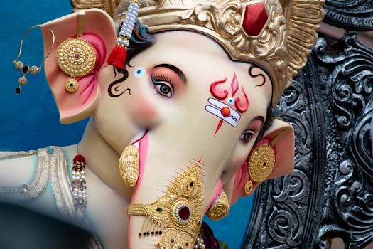 Close-up of a beautifully ornate Ganesha idol in Mumbai, showcasing rich cultural details.