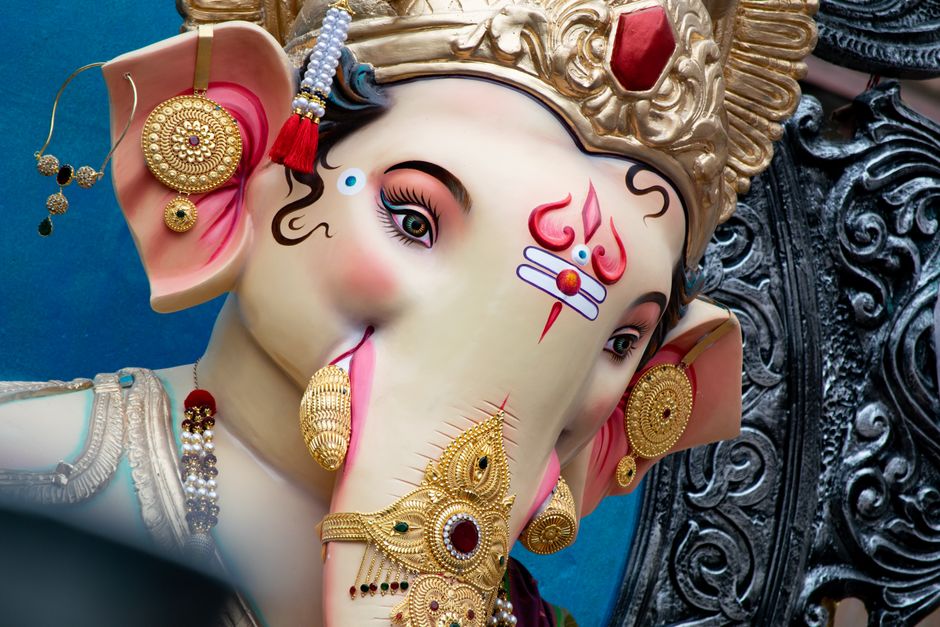 Close-up of a beautifully ornate Ganesha idol in Mumbai, showcasing rich cultural details.