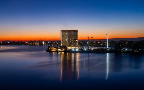 Sunrise on the lake with building and reflections