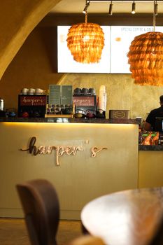 Inviting cafe interior featuring warm lighting and stylish decor.