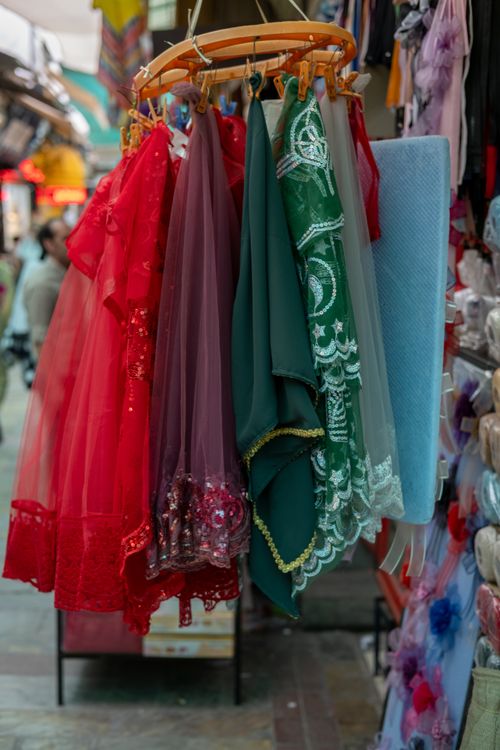 Free Vibrant fabrics on display in a bustling market in İzmir, Türkiye. Stock Photo