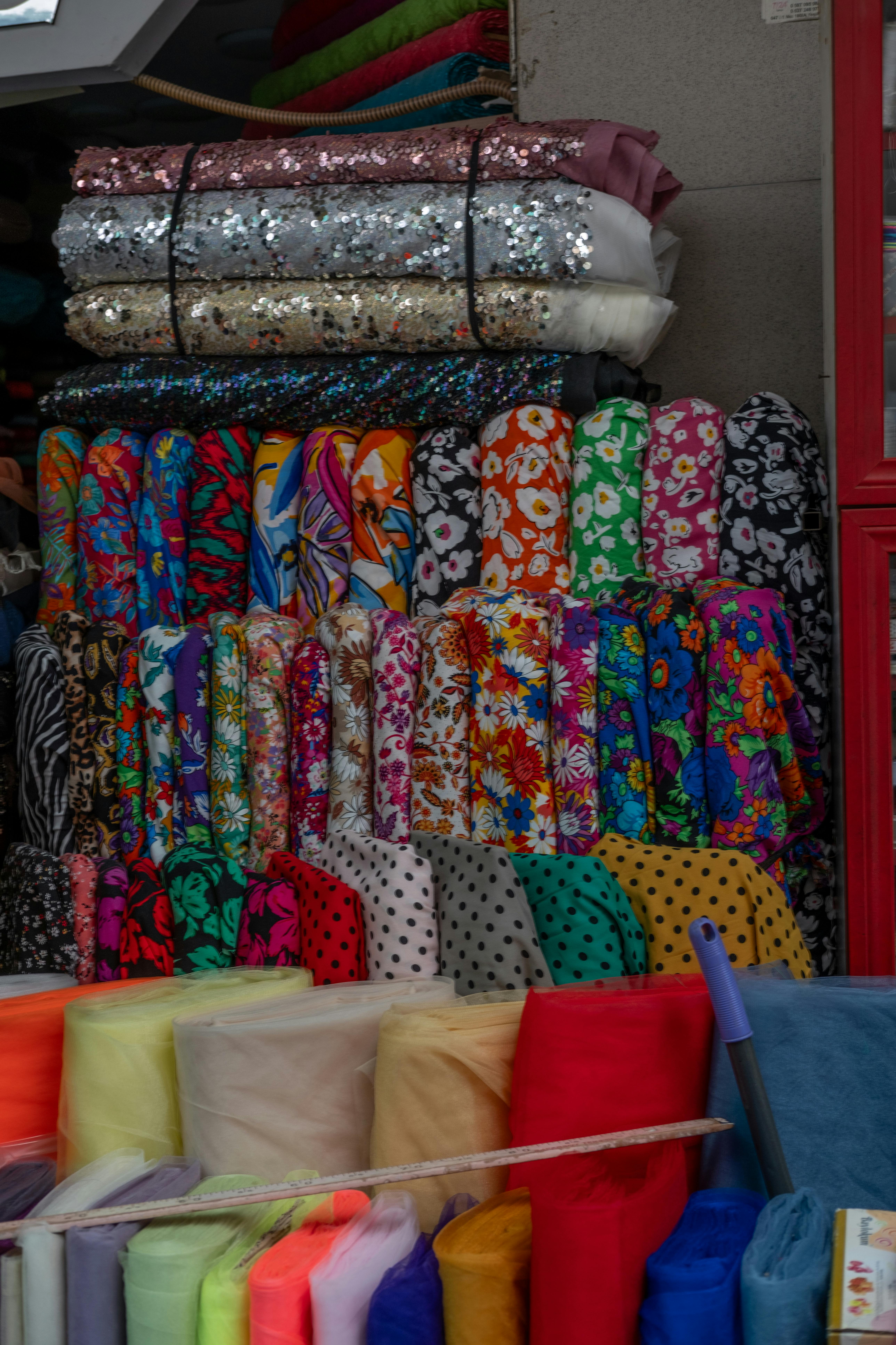 Traditional Malay fabrics and batik textiles on display at Arab Street shops in Kampong Glam Singapore