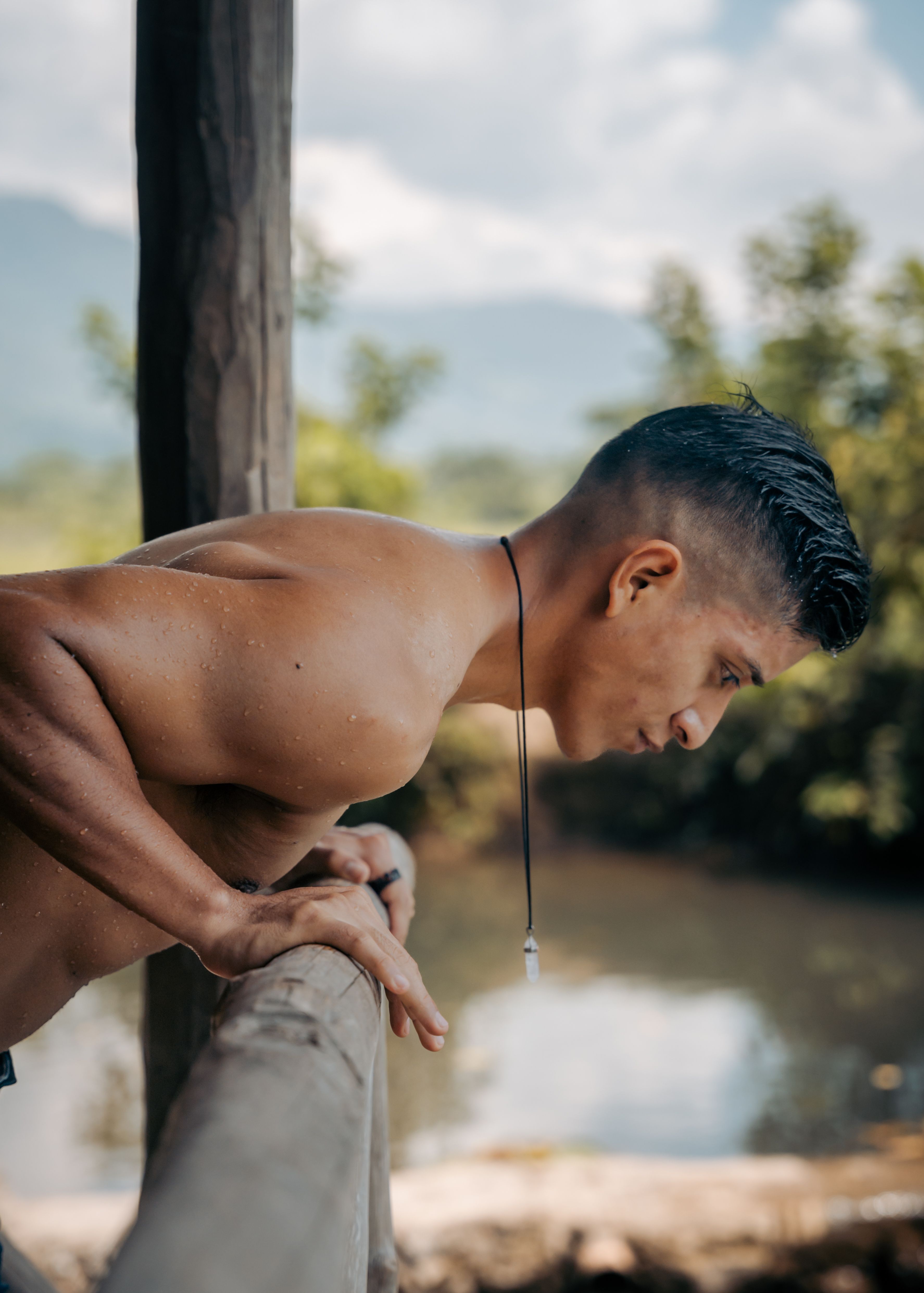 Man Looking Threw a Wooden Railing · Free Stock Photo
