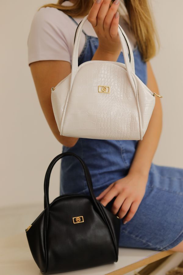 Black and white handbags in studio — demo image