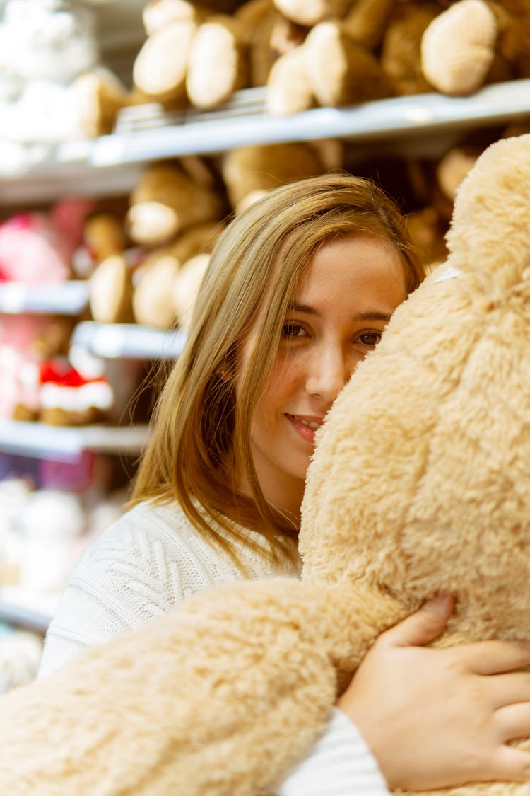 Woman Hugging A Teddy Bear 