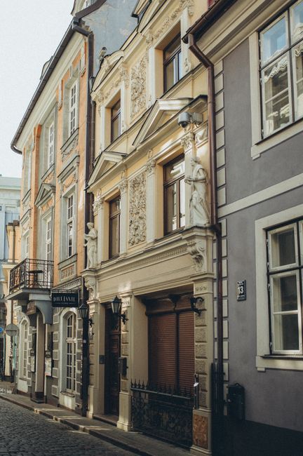 Discover a quaint old town street lined with beautifully ornamented, historic buildings.