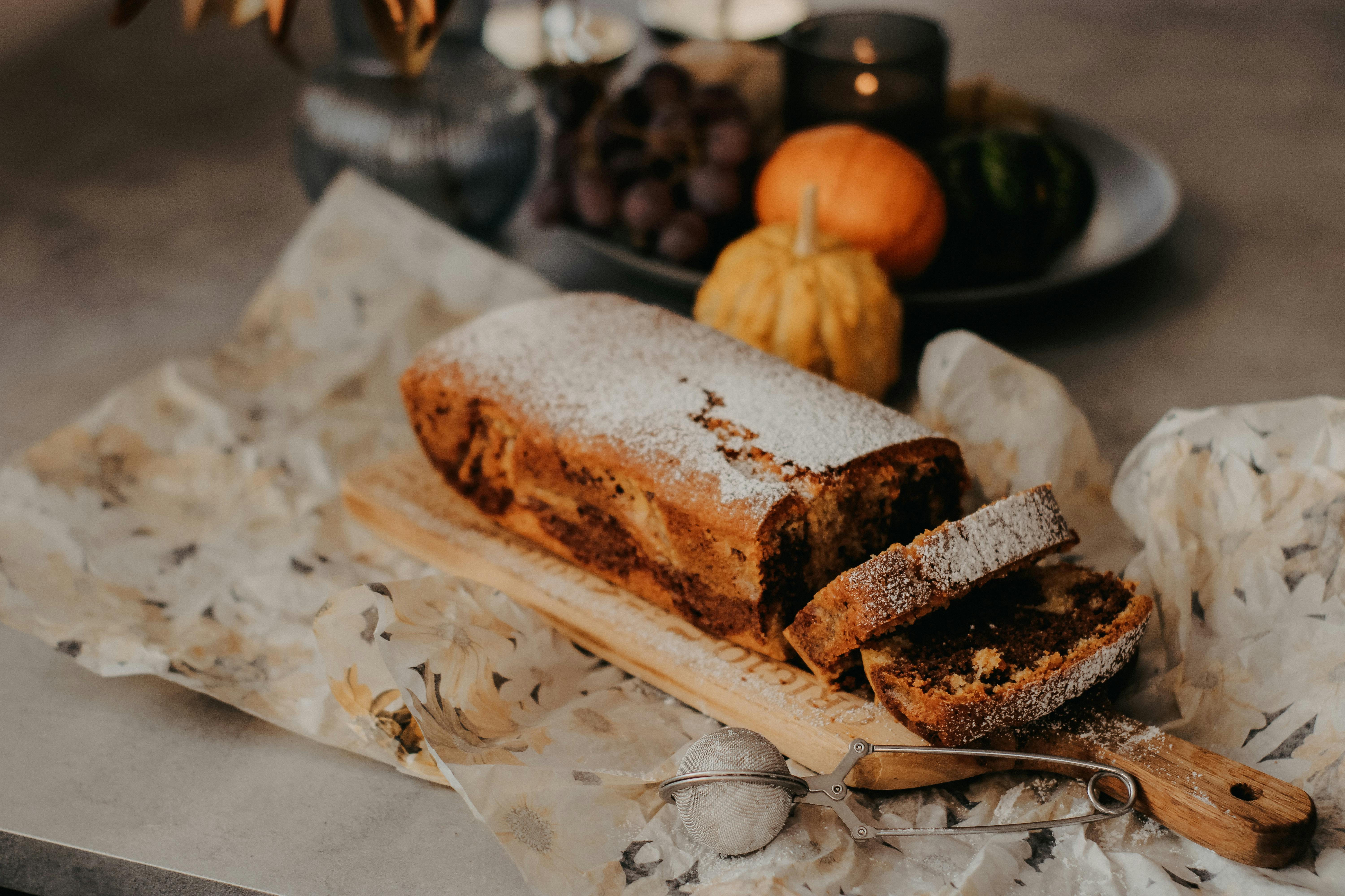 Warm, rustic homemade bread with autumn decorations for a cozy holiday vibe.