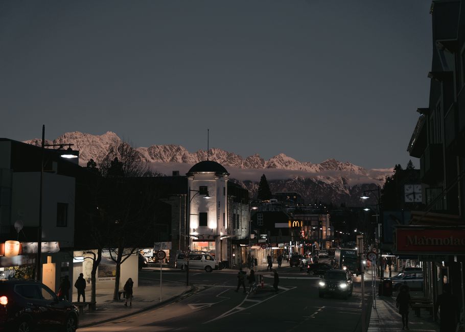 Ultimate 25-Minute Remarkables Helicopter Tour from Queenstown Review Review 2026 - Discover Queenstown's charming streets against a majestic mountain backdrop at dusk.
