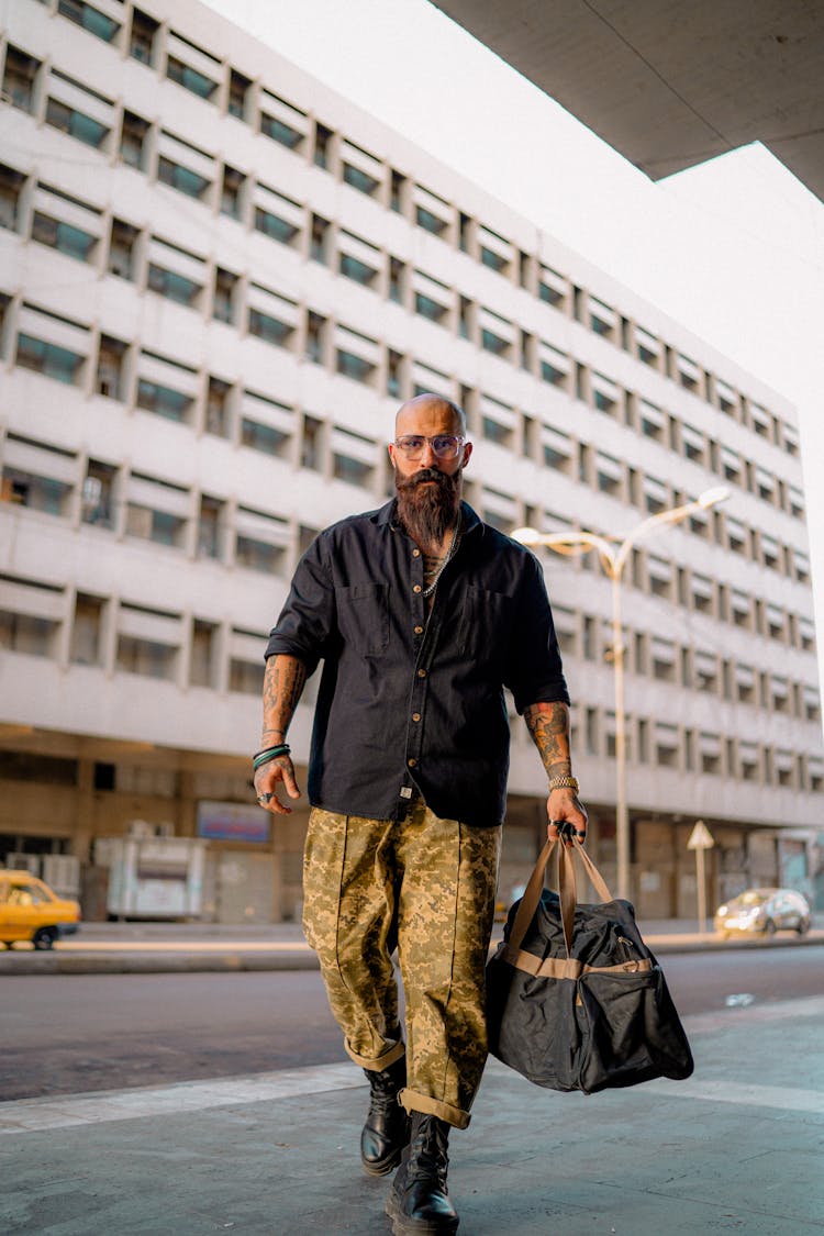 Bald Man With Beard And In Black Shirt