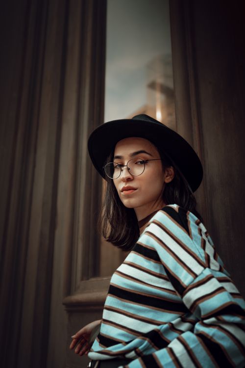 Free Fashionable woman with glasses and hat in İstanbul urban setting. Stock Photo