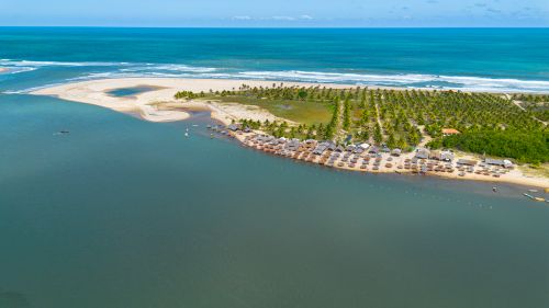 Free A stunning aerial view of a tropical beach resort in Jandaíra, Brazil, showcasing serene ocean waters. Stock Photo