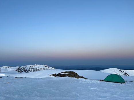 Green Tent on Snow