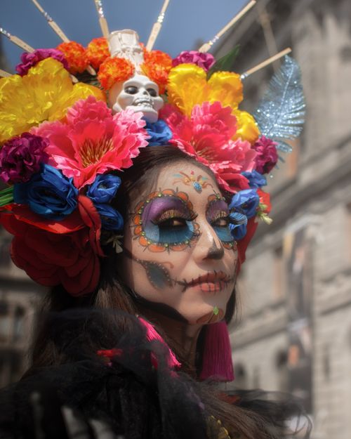 Free Colorful Catrina adorned with flowers celebrating Dia de Muertos in Mexico City. Stock Photo