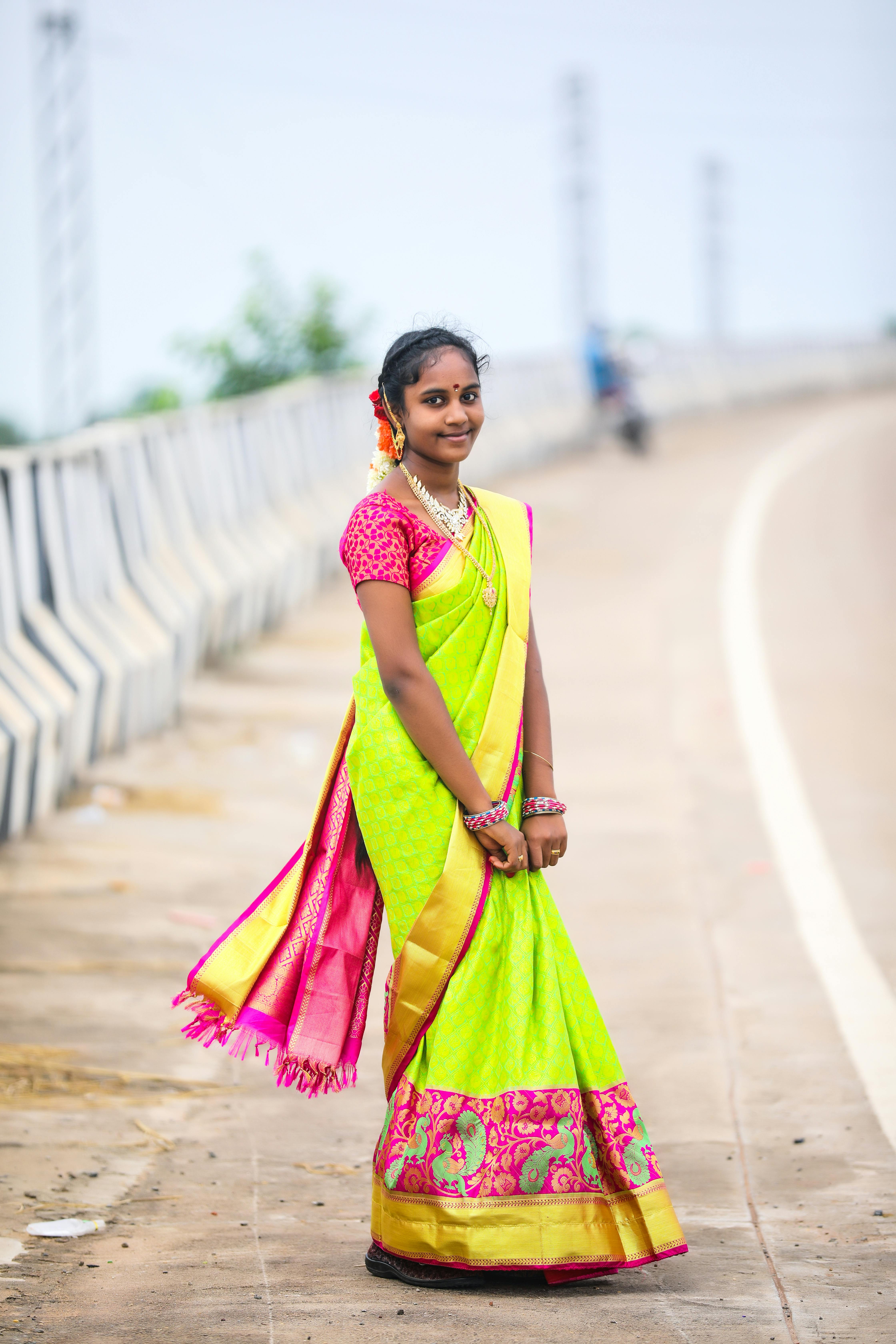 A Woman in Pink Sari Standing and Posing · Free Stock Photo