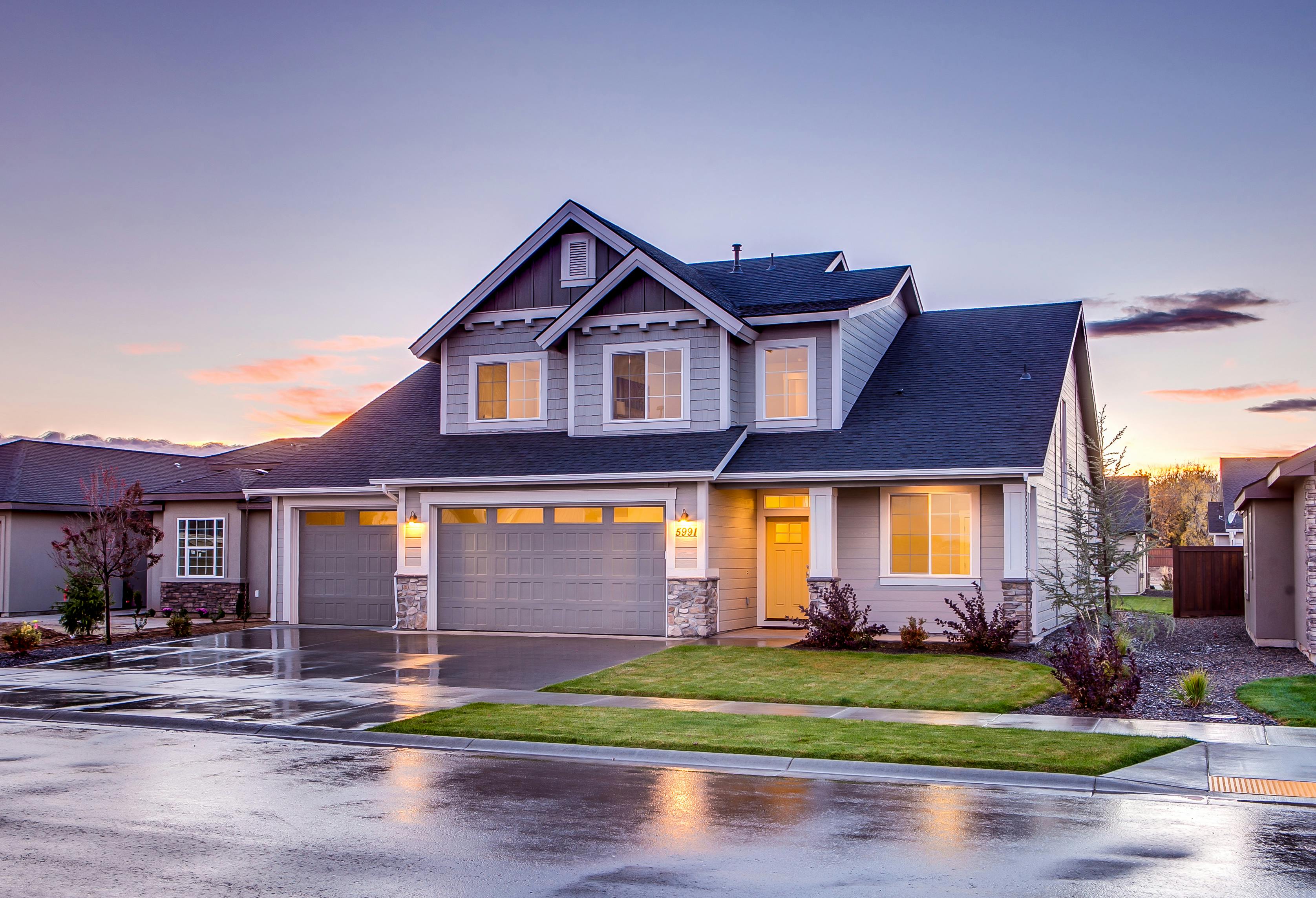 Premium Photo | A house by the lake with a sunset in the background