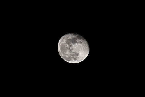 Free Capture of the full moon with detailed craters against a dark night sky. Stock Photo