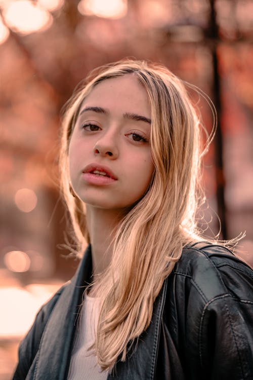 Portrait of a Blonde Girl in a Park