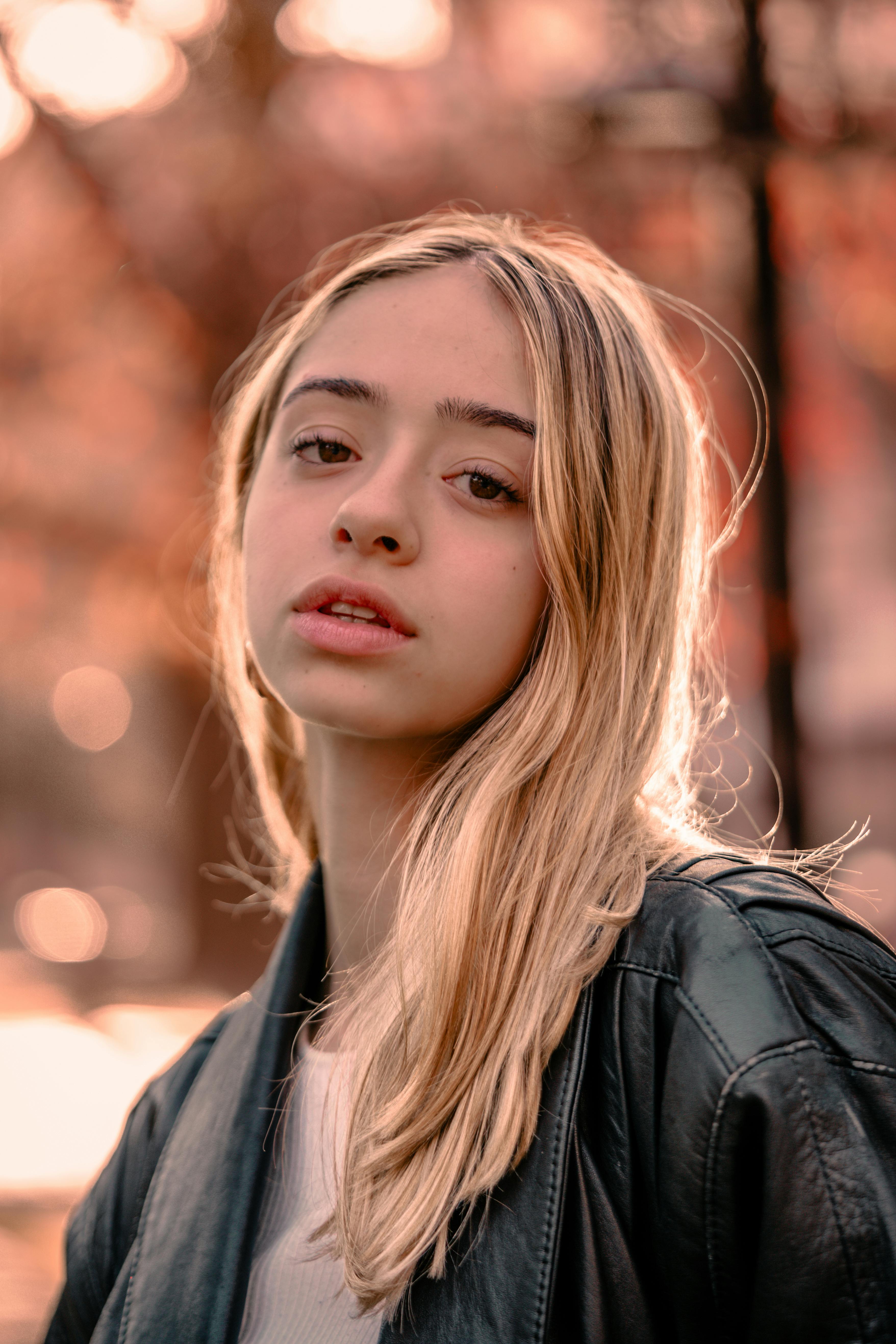 Portrait of a Blonde Girl in a Park · Free Stock Photo