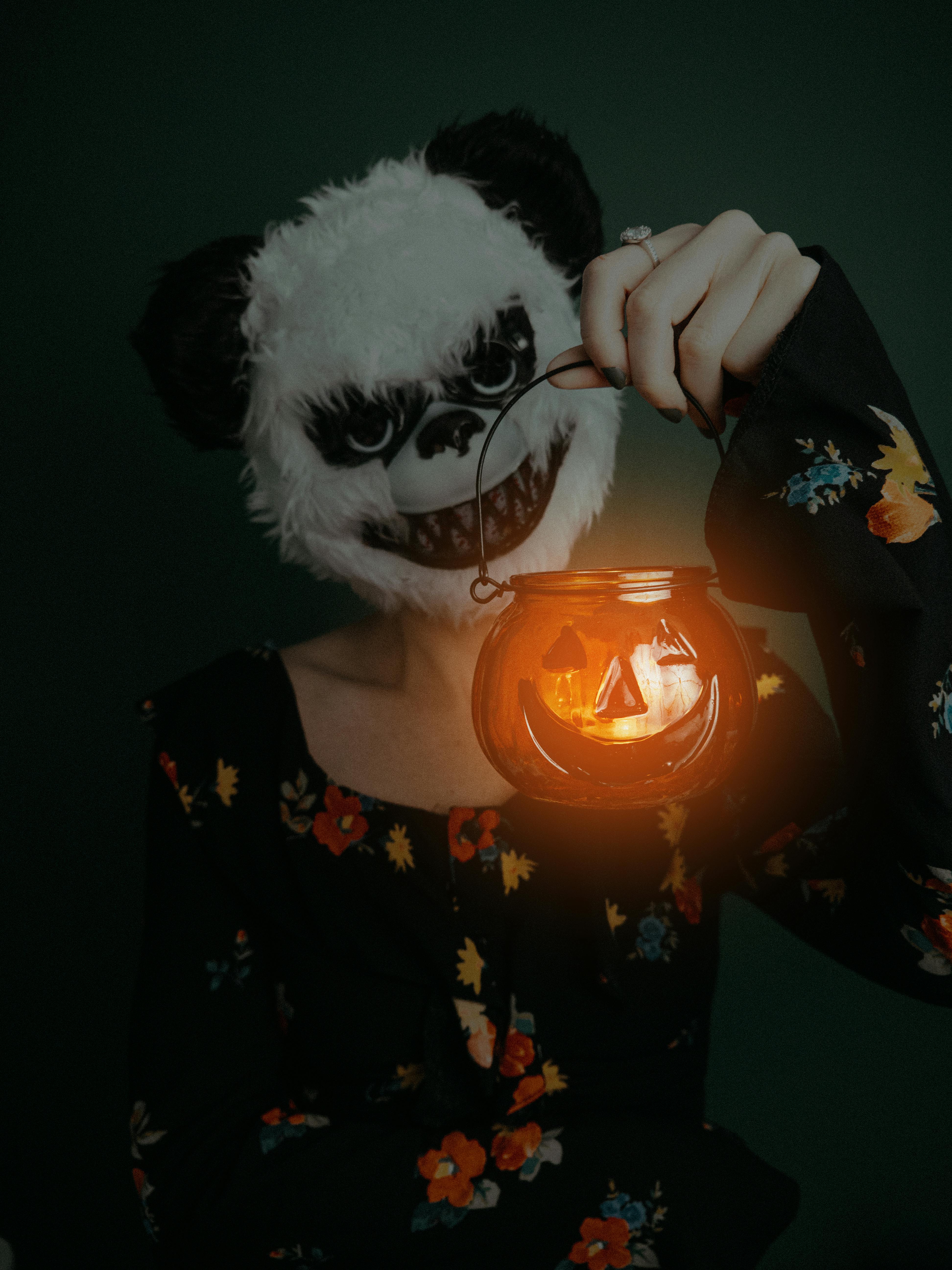 Woman with Lantern Wearing Creepy Halloween Mask · Free Stock Photo