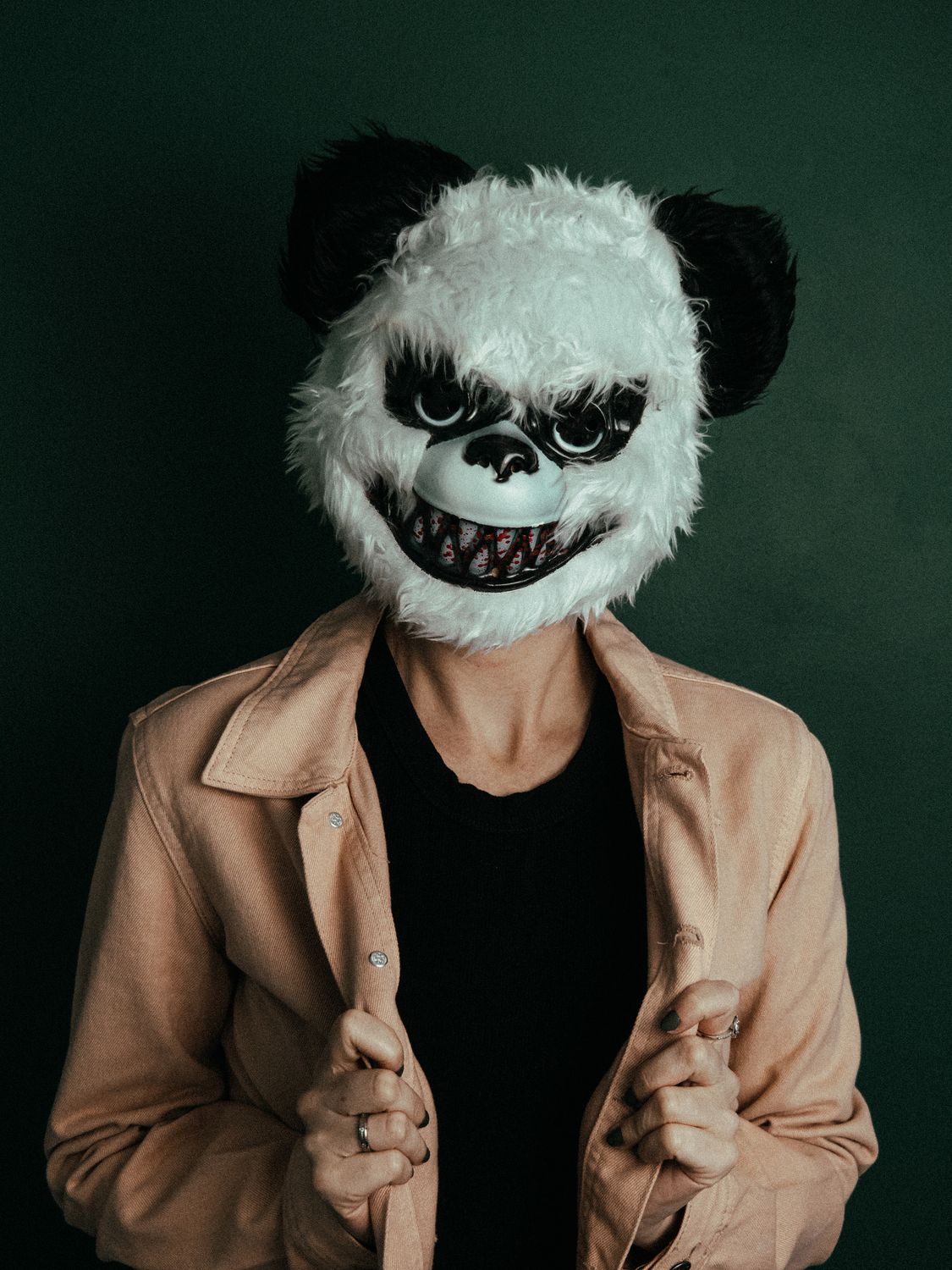Intimidating Jacket Woman Wearing a Scary Halloween Mask · Free Stock Photo
