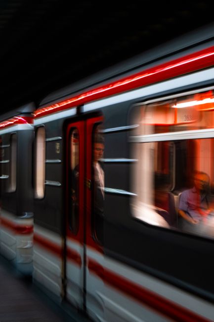 Dynamic shot of a metro train in motion highlighting urban public transportation.