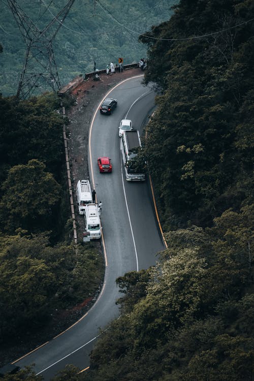 Vehicles on Road Curve on Mountainside