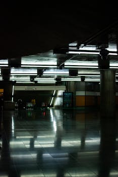 Underground metro station in São Paulo with modern lighting and escalators.