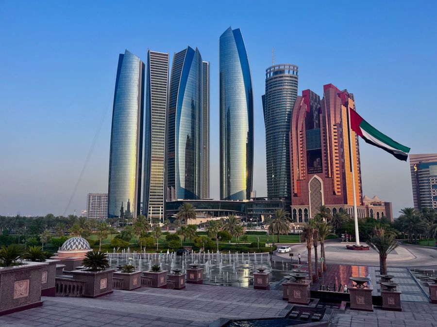 Etihad Towers and Abu Dhabi cityscape at sunset