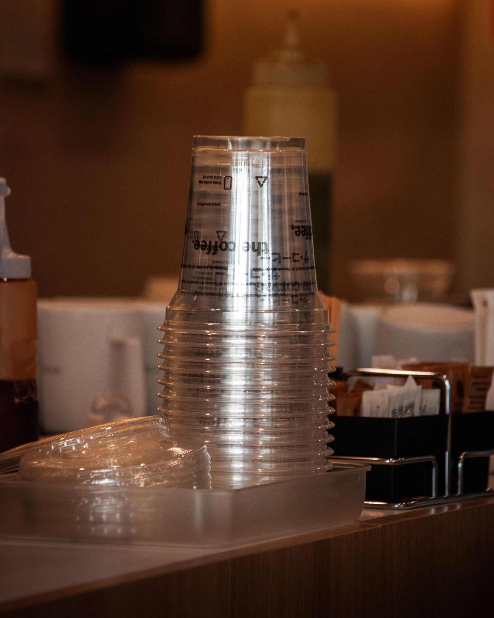 Stacked disposable plastic cups made for beverage service rather than automatic microwave use