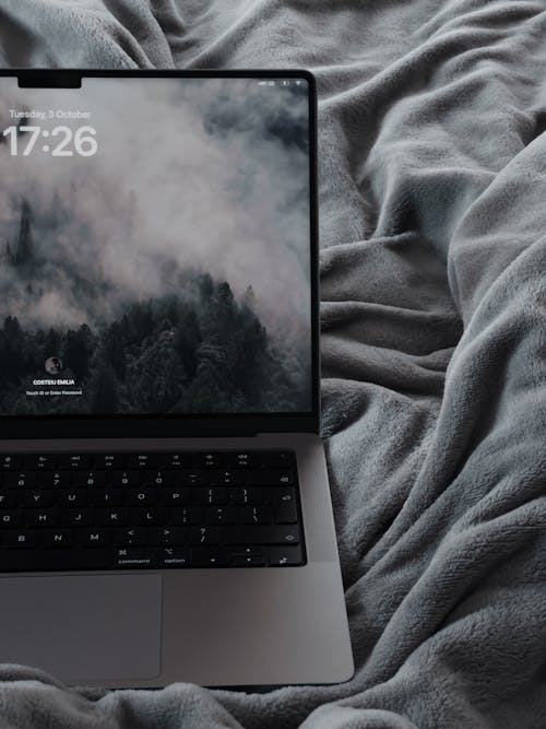 Laptop on Gray Blanket