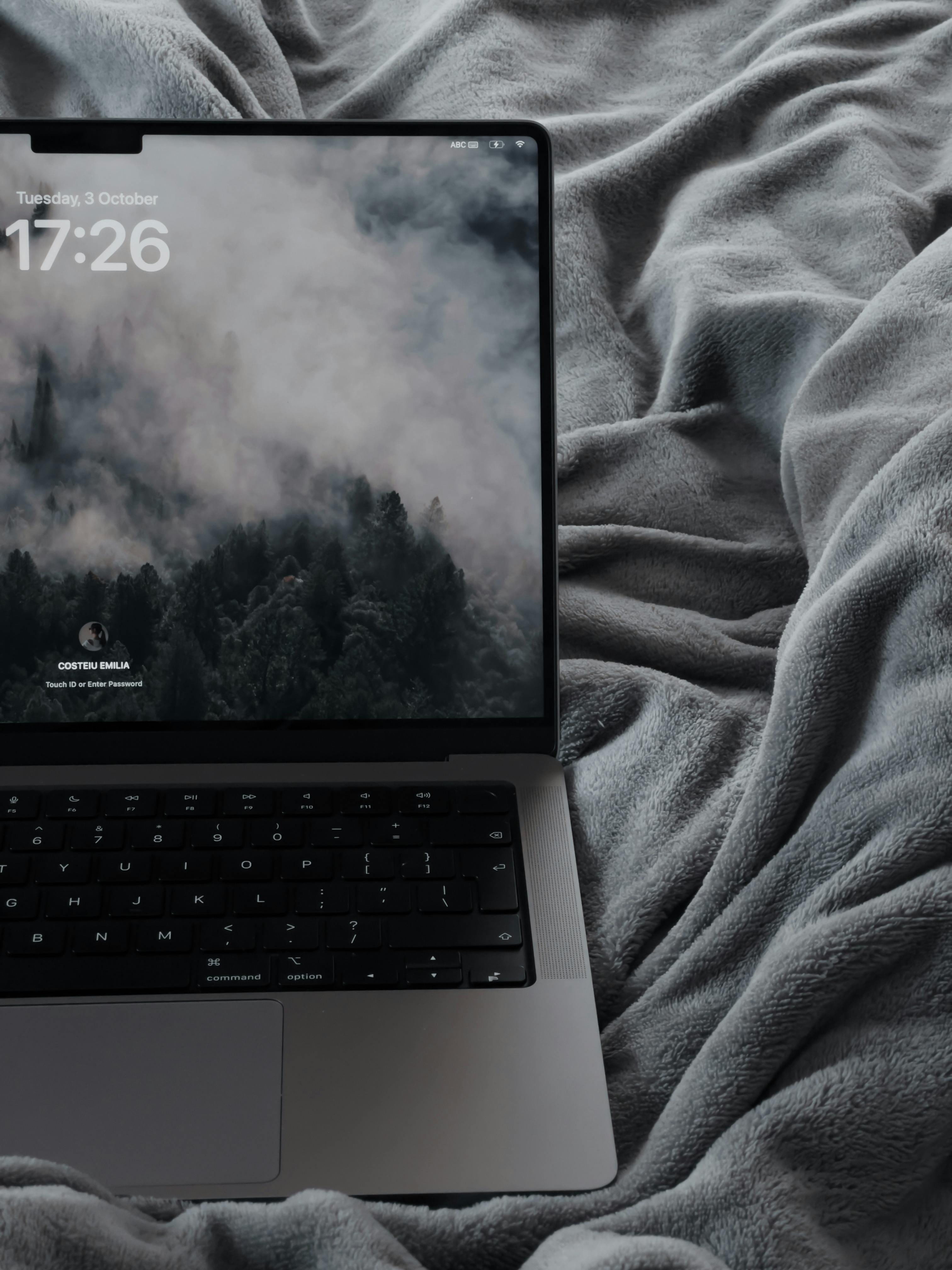 Laptop on Gray Blanket · Free Stock Photo