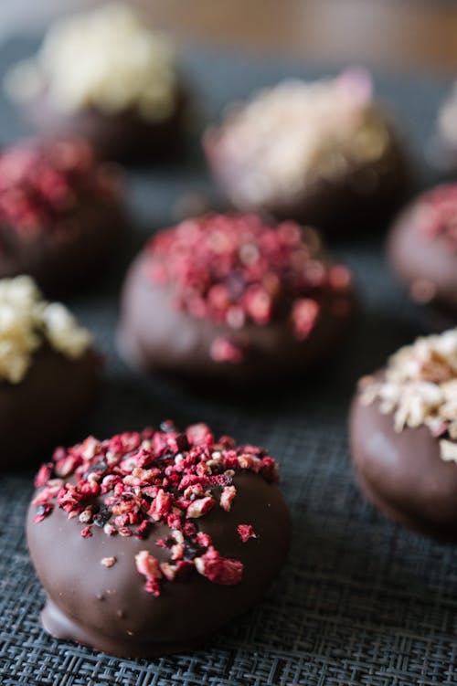 Chocolate covered donuts with sprinkles on top