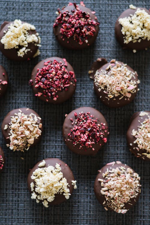 Chocolate covered fruit balls with nuts and berries