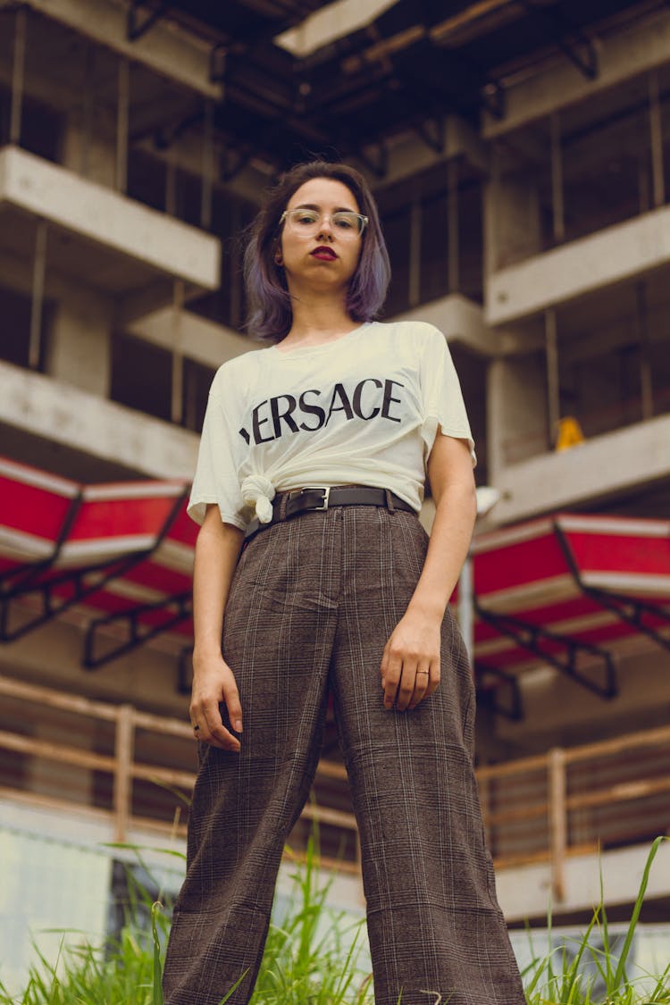 Low Angle Photography Of Woman Standing Near Building