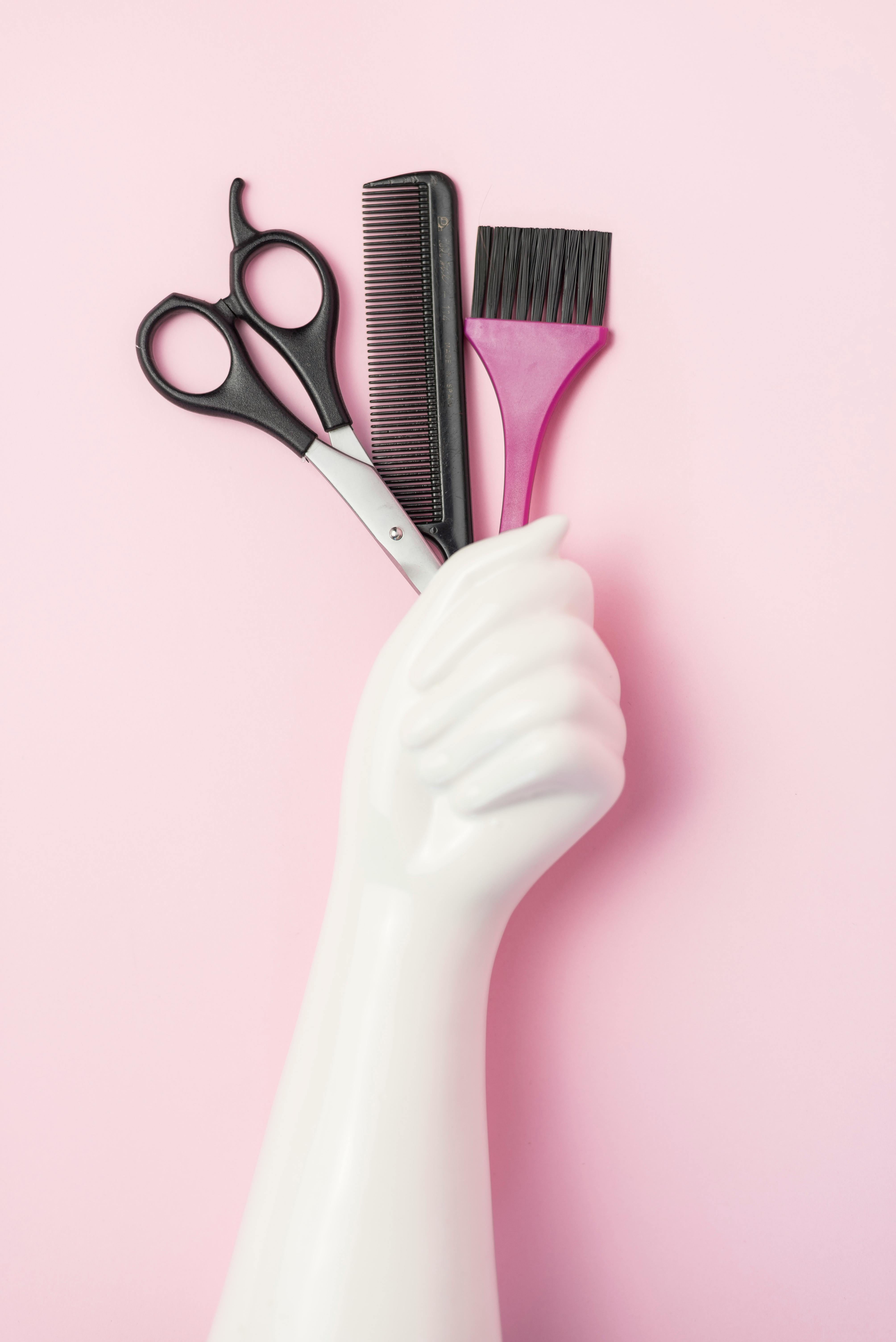 free-photo-of-a-hand-holding-a-pair-of-scissors-and-a-comb.jpeg?auto\u003dcompress\u0026cs\u003dtinysrgb\u0026dpr\u003d1\u0026w\u003d500