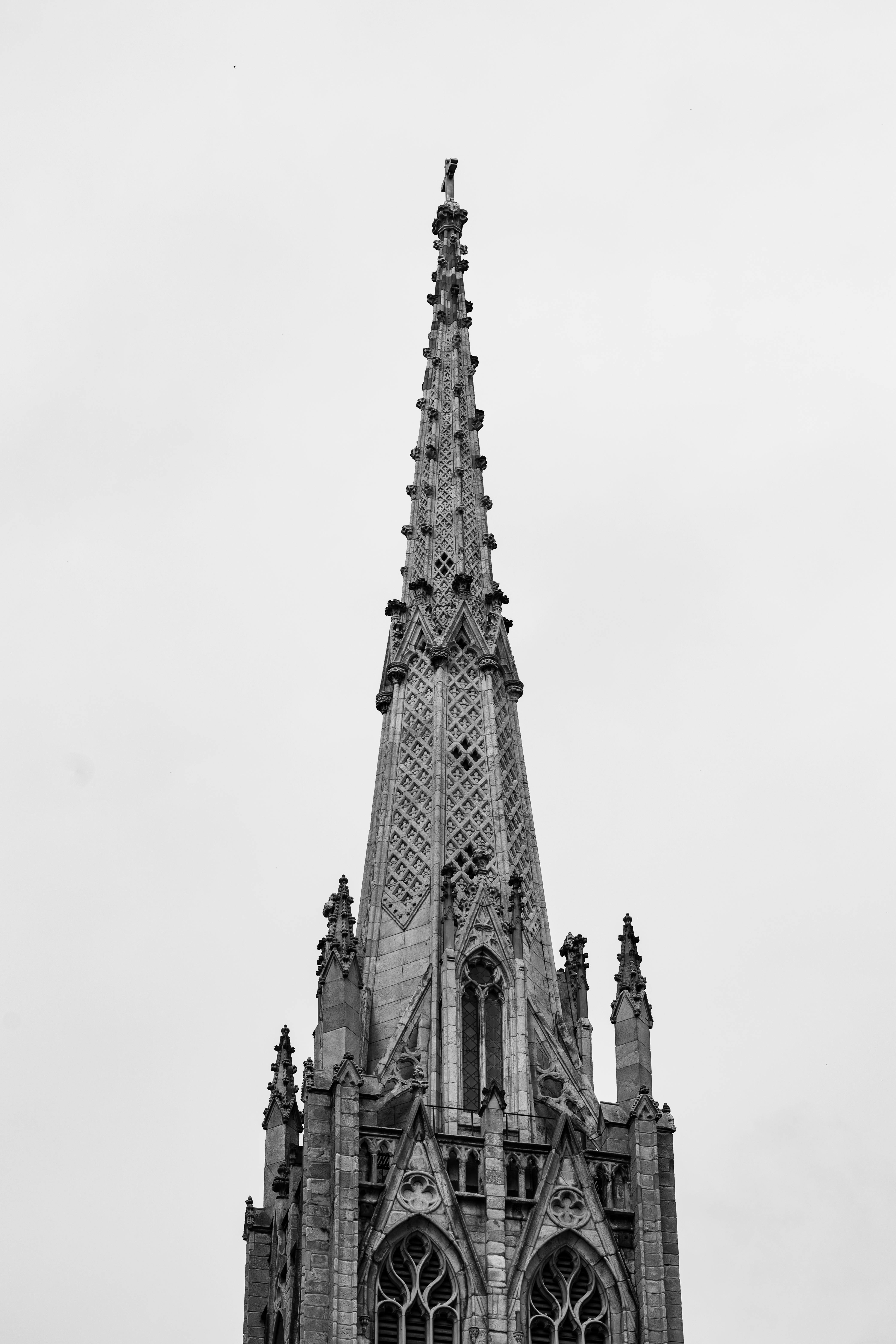 a black and white photo of a church steeple