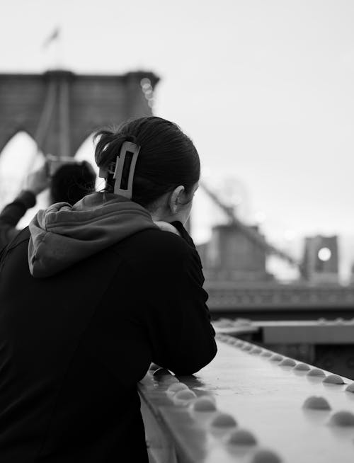Woman Looking at a View from Brooklyn Bridge 