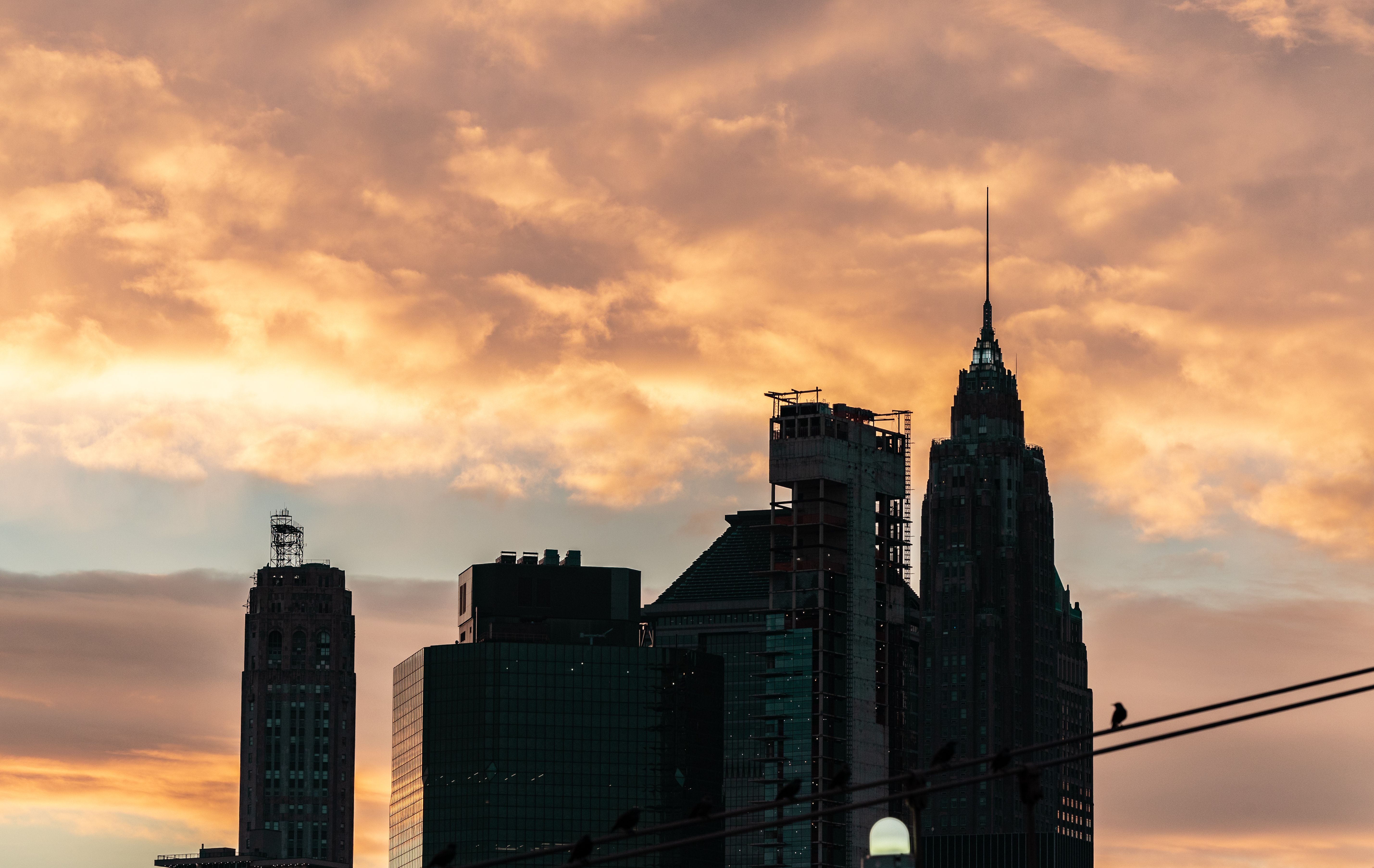 A sunset over the city skyline with buildings · Free Stock Photo