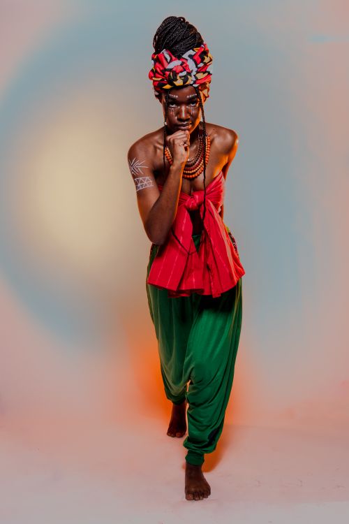 Free Model in vibrant traditional attire posing in a studio setting. Stock Photo